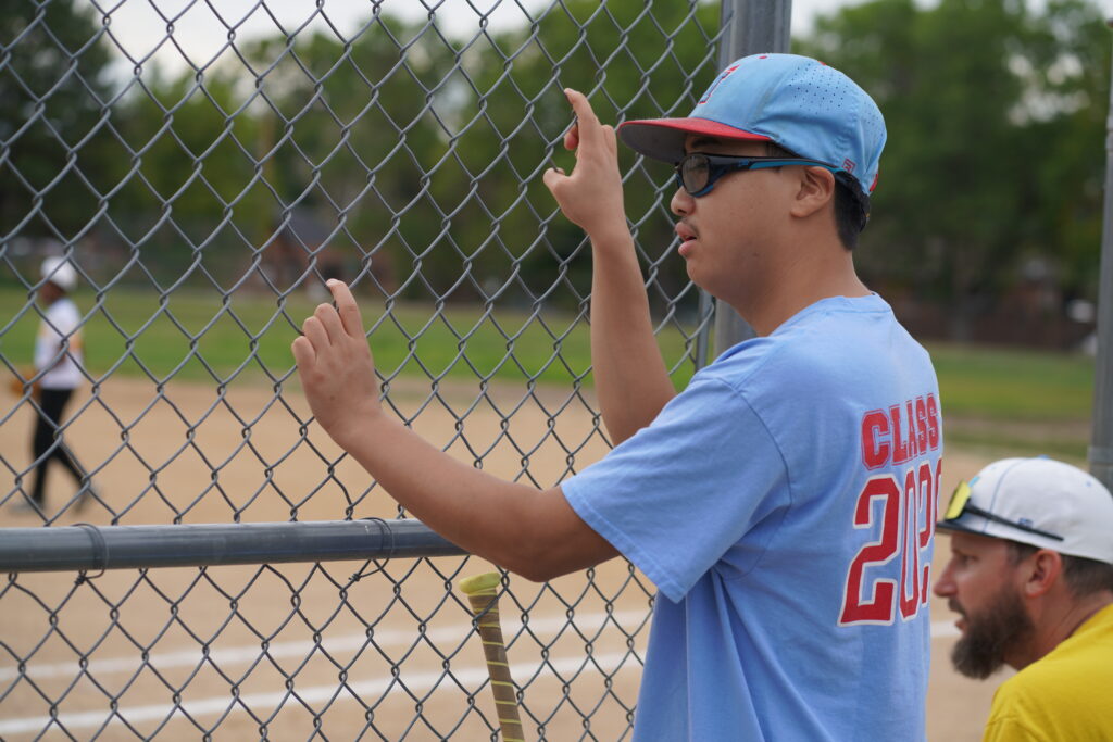 Taber at the baseball field, where his interest in coaching has become an assistant coaching opportunity.